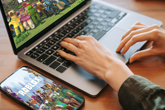 Riga, Latvia - February 2, 2026: Roblox Game on Laptop and Smartphone &ndash; Online Gaming Setup