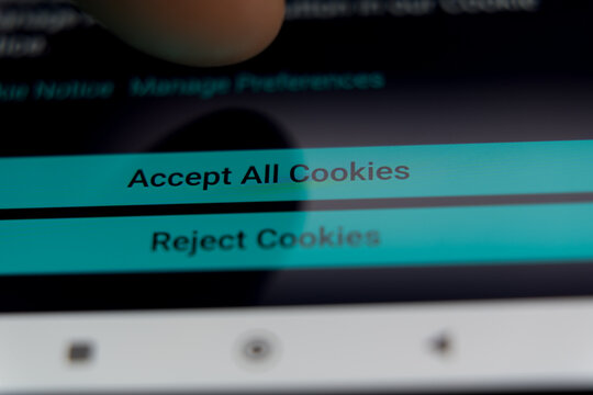 Close-up of a finger about to press the Accept All Cookies button on a website consent banner, illustrating internet privacy, user data tracking, and GDPR compliance.