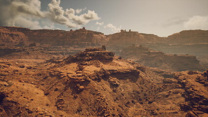 rugged desert ridge with survey vehicle on dusty trail, rocky terrain and dramatic cloudscape, panoramic ochre landscape conveying scale and isolation, © icetray