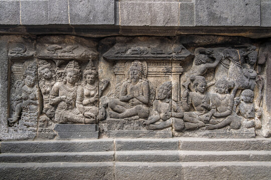 Closeup view of ancient stone bas-relief of rishi Vishvamitra meeting king Dasharatha, Shiva temple, Prambanan, Yogyakarta, Central Java, Indonesia