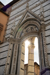 Obraz premium Italy Tuscany Siena Cathedral view of the Duomo reflections and play of sunlight between the arches and marble columns