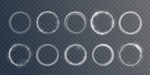 Round shimmering frame with radiant particles floats on transparent field. Golden shine adds magic mood. © Little Monster 2070