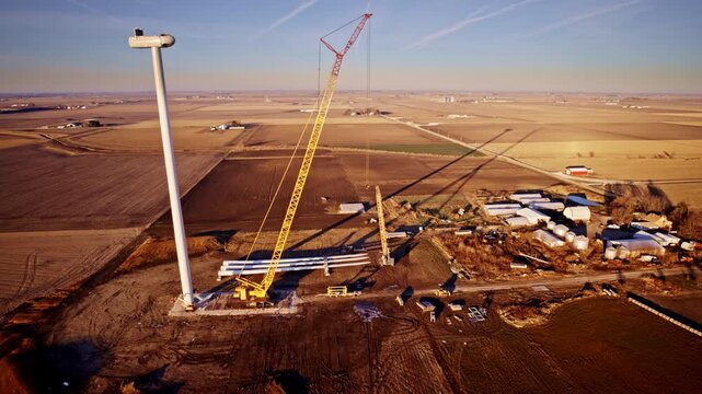 Slow moving aerial view circling wind energy project under development
