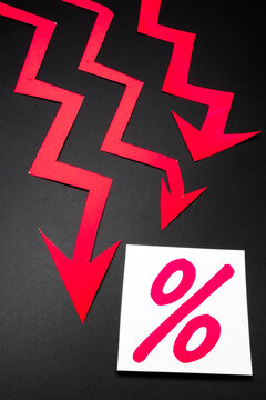 Red arrows of the graph peaking downwards.
