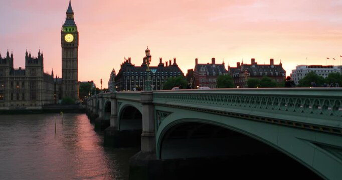 London, UK. Sunset over the city of London, UK. Colorful sky behind Westminster and Big Ben. Westminster bridge at night