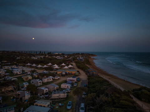 Torquay at sunset showing glamping tents