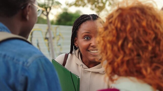 An enthusiastic woman is passionately engaging in a lively conversation with her friends, sharing her thoughts and ideas, creating an atmosphere of camaraderie and connection among the group.