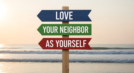 Fototapeta premium Love your neighbor as yourself signpost on serene beach at sunrise or sunset with calm ocean waves