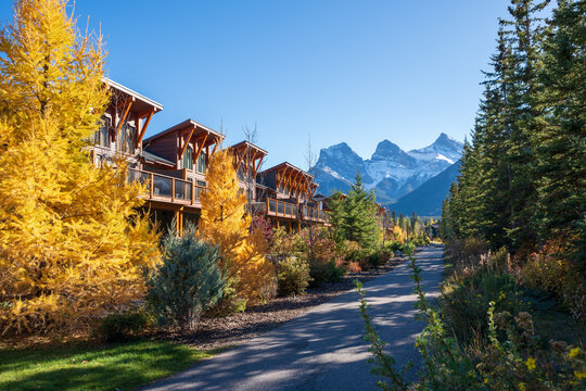 Walking trail in residential area. Town of Canmore street view in fall season. Alberta, Canada.