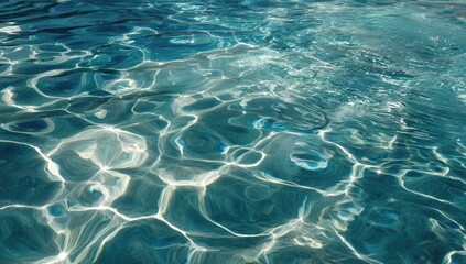 Obraz premium Close-up of sunlit water surface, showcasing intricate patterns and reflections on a pool