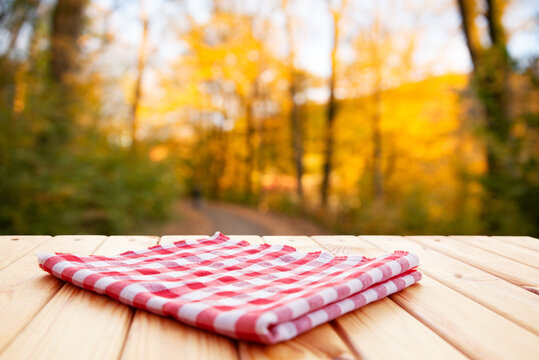 Beautiful autumn sunset scene with empty wooden table. Natural template landscape. High quality photo