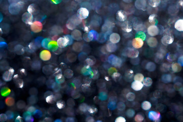 Shiny luxury glitter rainbow glow light flare with bokeh background