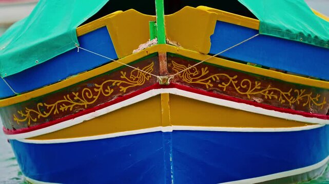 Malta, Marsalokk, - 11.11.2025: Traditional colorful fishing boats with a distinctive shape anchored in the bay