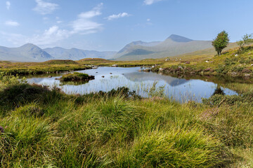 Fototapeta premium Calm lake with mountain reflection in Scotland