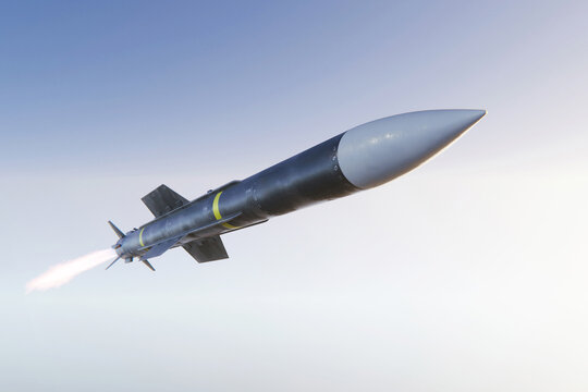 Military ballistic missile launching into a clear sky with a bright fire trail.  defense technology, strategic weapons, national security, and aerospace engineering. World War 3, concept