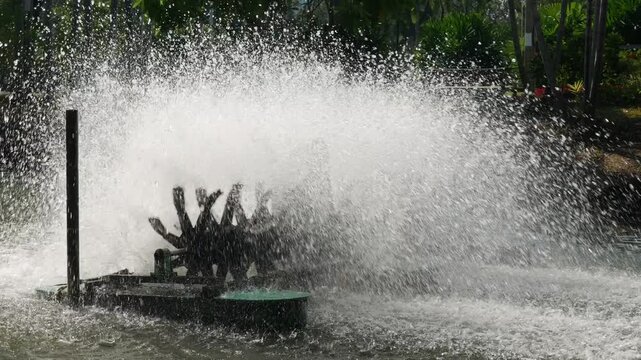 Water aerator turbine fountain creating massive spray for oxygen circulation and wastewater treatment in urban park pond