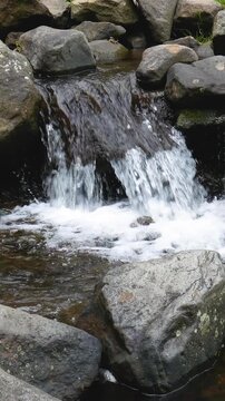 Mountain river with smooth current and natural detail. Suitable for Vertical mobile campaigns and scenic visuals.