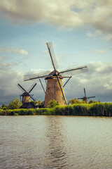Naklejka premium Historic Dutch architecture featuring multiple windmills in Kinderdijk Netherlands