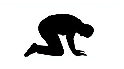 Obraz premium Silhouette of a person in a kneeling position with hands touching the ground