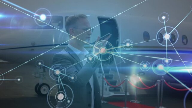 Animation of network of connections over caucasian businessmen on airport