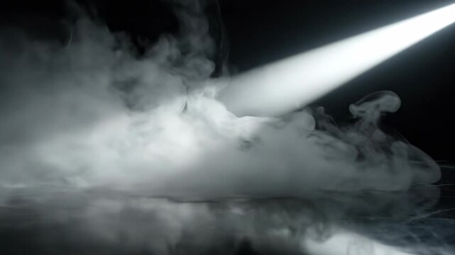 Side angle view of atmospheric fog and haze diffusing and rolling across a dark surface dramatically illuminated by a narrow light beam texture, mystical, atmospheric