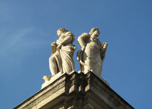 Pair of femal figues on the roof of the Dresden Zwinger building, Germany