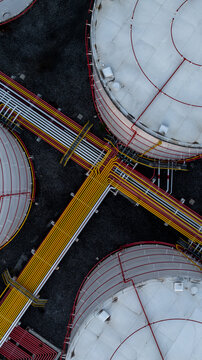 Aerial view white oil storage tank with pipeline steel, Crude oil industry, Storage fuel gas container tank petroleum refinery industrial factory, Oil storage chemical petrochemical refinery product.