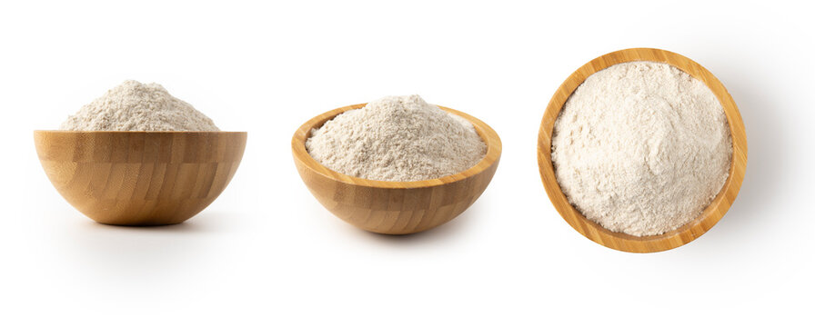 whole wheat flour in bowl isolated on white background