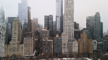 Fototapeta premium Drone view of Midtown Manhattan towers near Central Park on cloudy winter day