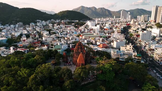 Drone view of the historic po nagar cham towers in nha trang, vietnam with the cityscape in the background