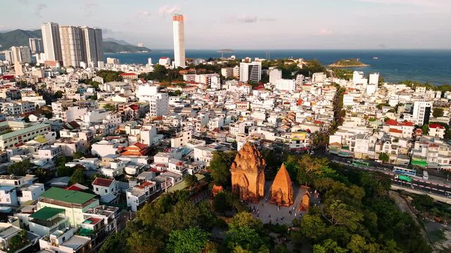 Aerial view of po nagar cham towers ancient temple complex in nha trang cityscape at sunset, vietnam