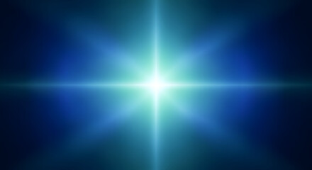 Fototapeta premium Bright light starburst with blue glow on dark background