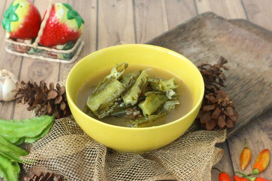 Sayur asam (or sayur asem), a refreshing Indonesian tamarind soup, features wing beans simmered in a clear, tangy broth infused with tamarind.