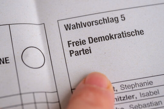 ballot paper Freie Demokratische Partei, finger approaching voting circle, liberal voter choice, pro-market ideology, centrist political participation, Germany&rsquo;s multi-party parliamentary democracy