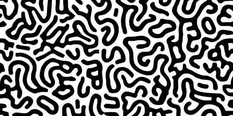 Abstract black and white pattern with organic shapes, resembling a maze or fluid structure