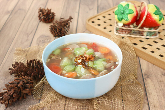Sup oyong, or sup gambas, an Indonesian-style clear soup made with oyong (Luffa acutangula), carrot, and meatballs.