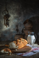 Fresh wheat bread and milk on a village table