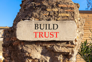 Build trust symbol. Concept words Build trust on beautiful big white sign plate. Beautiful old...