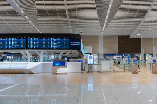 February 19, 2026, Incheon, South Korea - Interior view of Incheon International Airport Terminal 2 with flight information displays and self-check-in kiosks