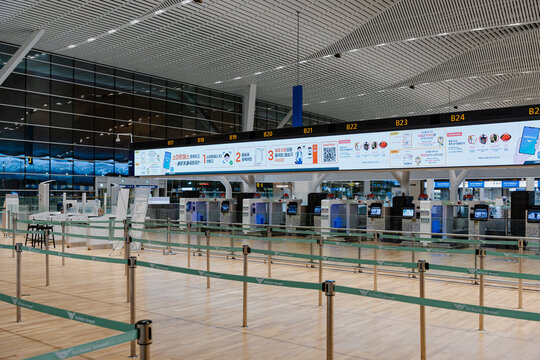 February 19, 2026, Incheon, South Korea - Empty check-in counters and SmartPass information display at Incheon International Airport Terminal 2