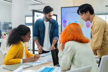 Obraz premium Creative business team presenting analytics dashboard in modern office meeting, teamwork communication, planning strategy, startup collaboration, corporate productivity.
