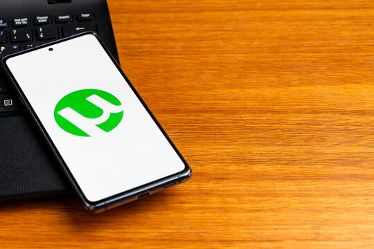Punta Arenas, Chile &ndash; February 23, 2026: The uTorrent logo displayed on a smartphone screen resting on a black laptop keyboard