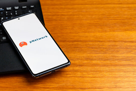 Punta Arenas, Chile &ndash; February 23, 2026: The pNetwork (PNT) cryptocurrency logo displayed on a smartphone screen resting on a black laptop keyboard