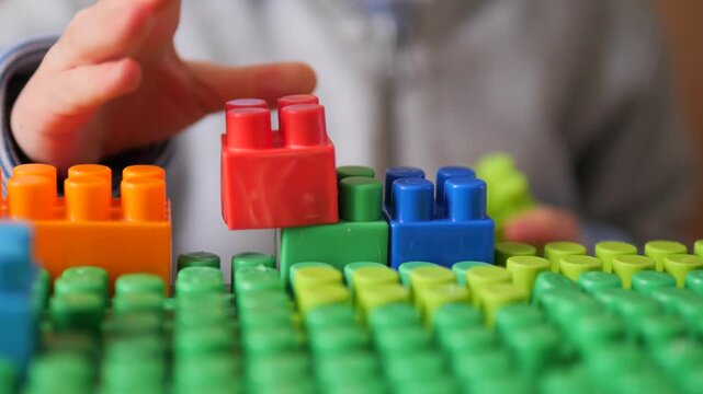 Child Hands Building Colorful Block Tower &ndash; Educational Creative Play with Toys and School Supplies