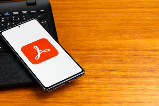 Punta Arenas, Chile &ndash; February 23, 2026: The Adobe Acrobat logo, featuring its iconic white stylized "A" on a red background, displayed on a smartphone screen