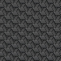 Geometric striped hexagonal seamless pattern. Interlocking abstract lines create a woven texture. Created in black and white with a monochromatic palette.