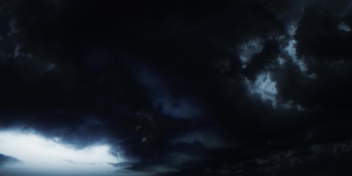 Dramatic thunderstorm with powerful lightning strikes illuminating dark, ominous clouds. Lightning illuminating dramatic clouds. Perfect for backgrounds, weather themes, and intense atmospheric visual