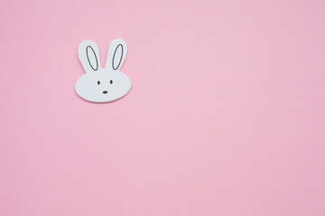 Obraz premium Cute White Bunny Head on Pink Background