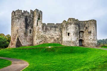 Fototapeta premium Autumn over Chepstow Castle and River Wye, Chepstow, Monmouthshire, Wales, UK