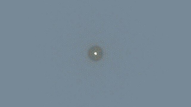 Small White Dot on Gray Background.